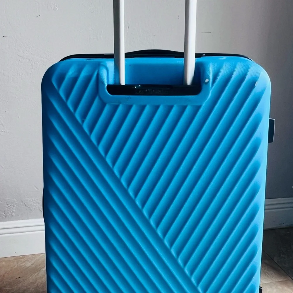 Medium Size Suitcase used but in brand new condition $35. Have 2 more. All 3 100